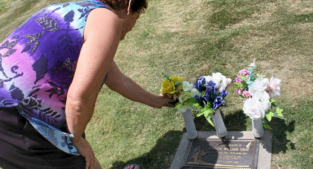 Jan Gray was disgusted to find dogs had desecrated her husband’s grave and is calling for owners to be responsible for their dogs.